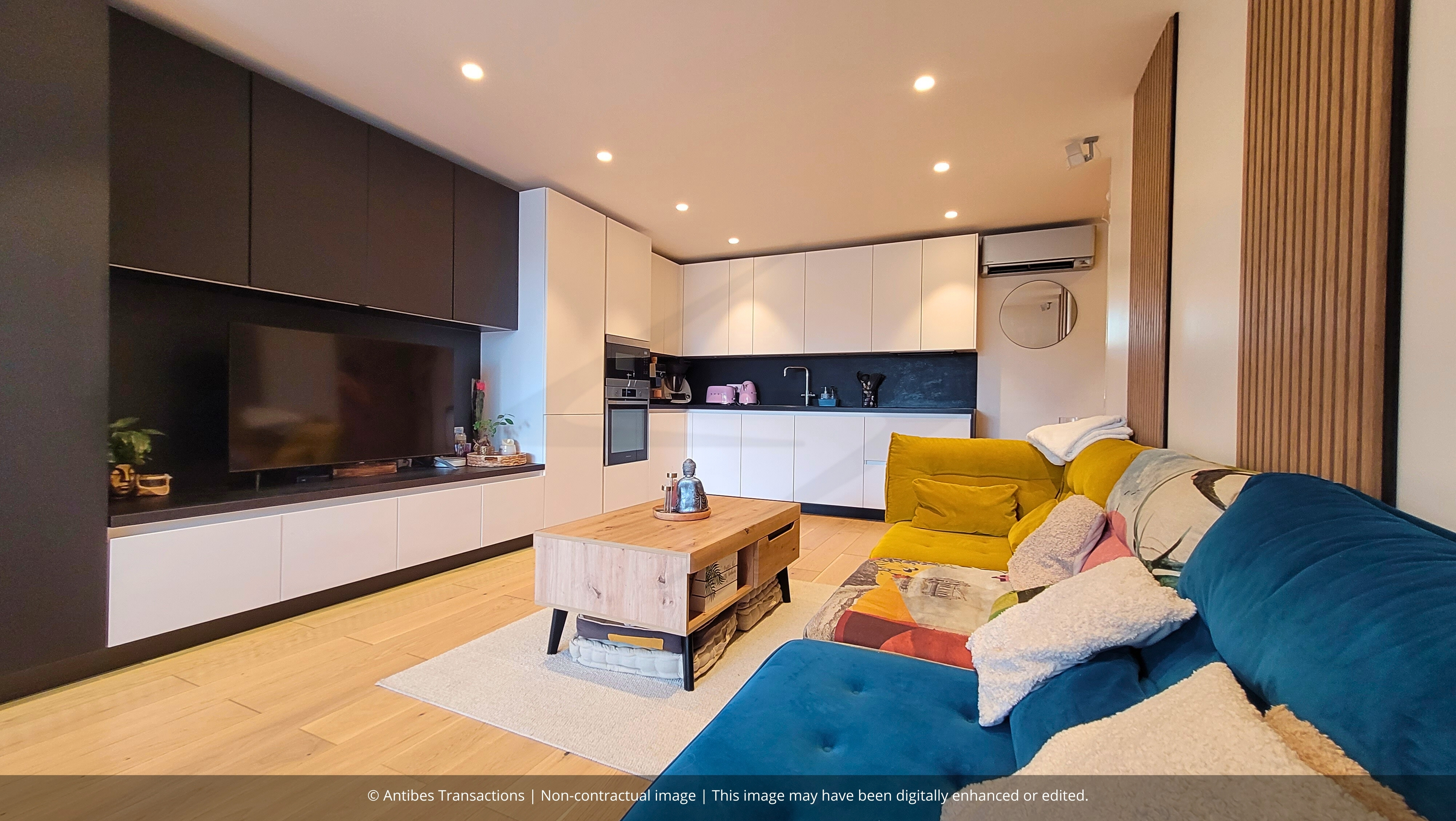 Living room and open-plan kitchen with bespoke furniture