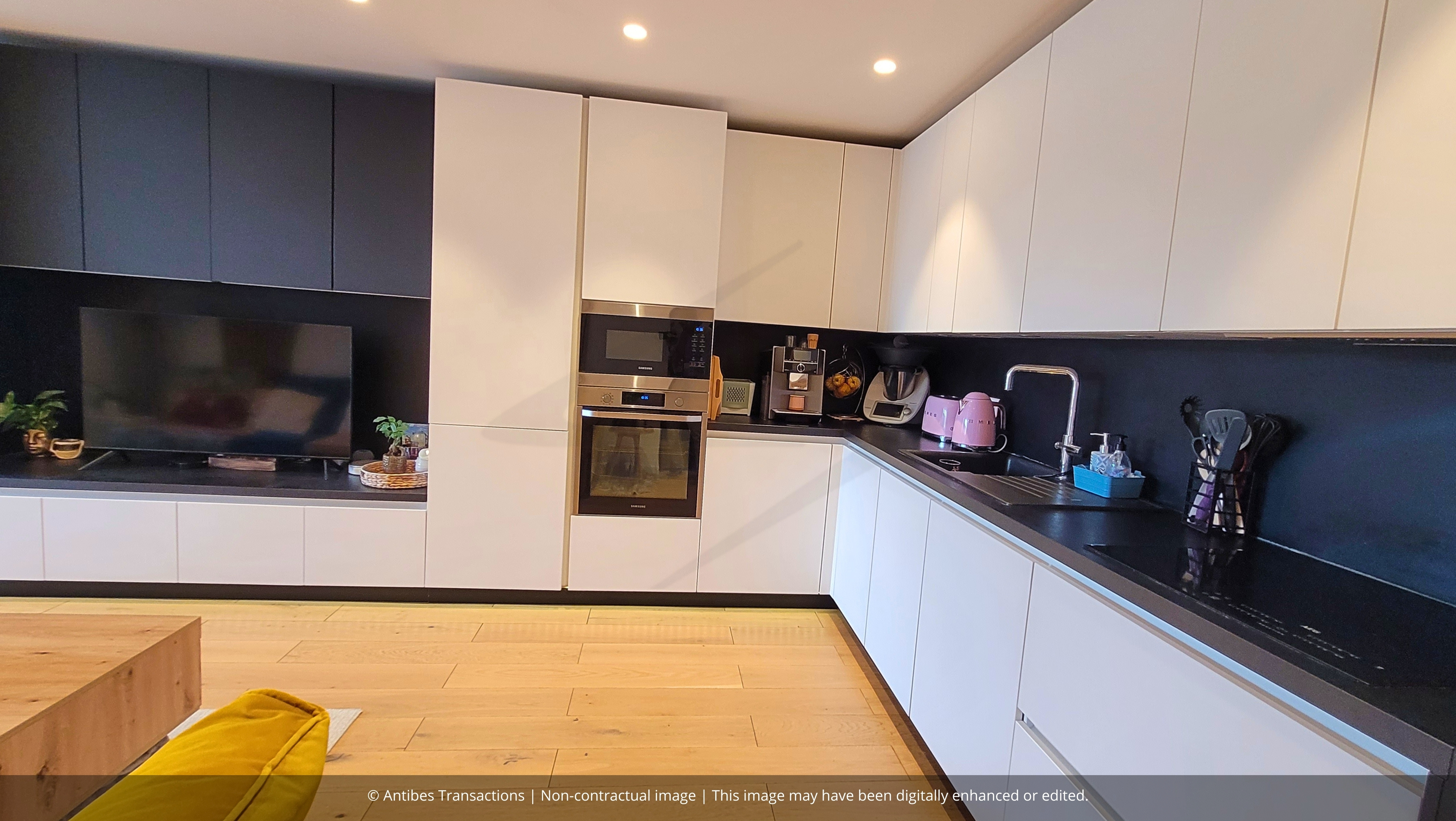 Open-plan kitchen with bespoke furniture
