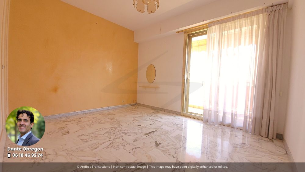 View of one of the three bedrooms