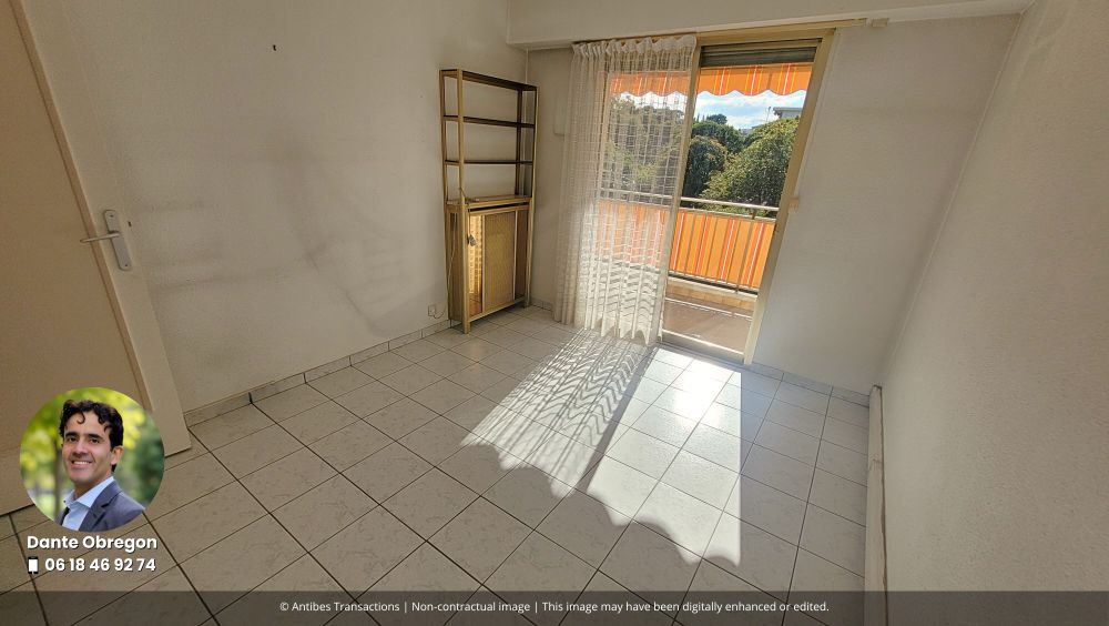 View of one of the three bedrooms