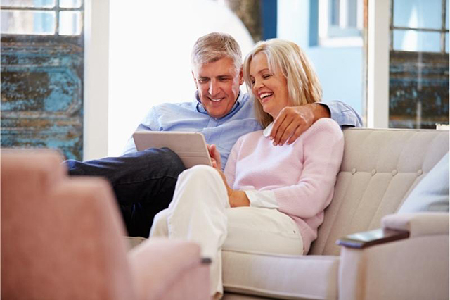 couple of home owners looking at a computer screen